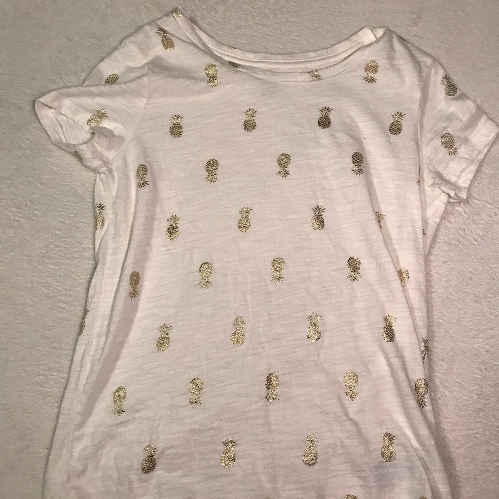 A white and gold pineapple shirt